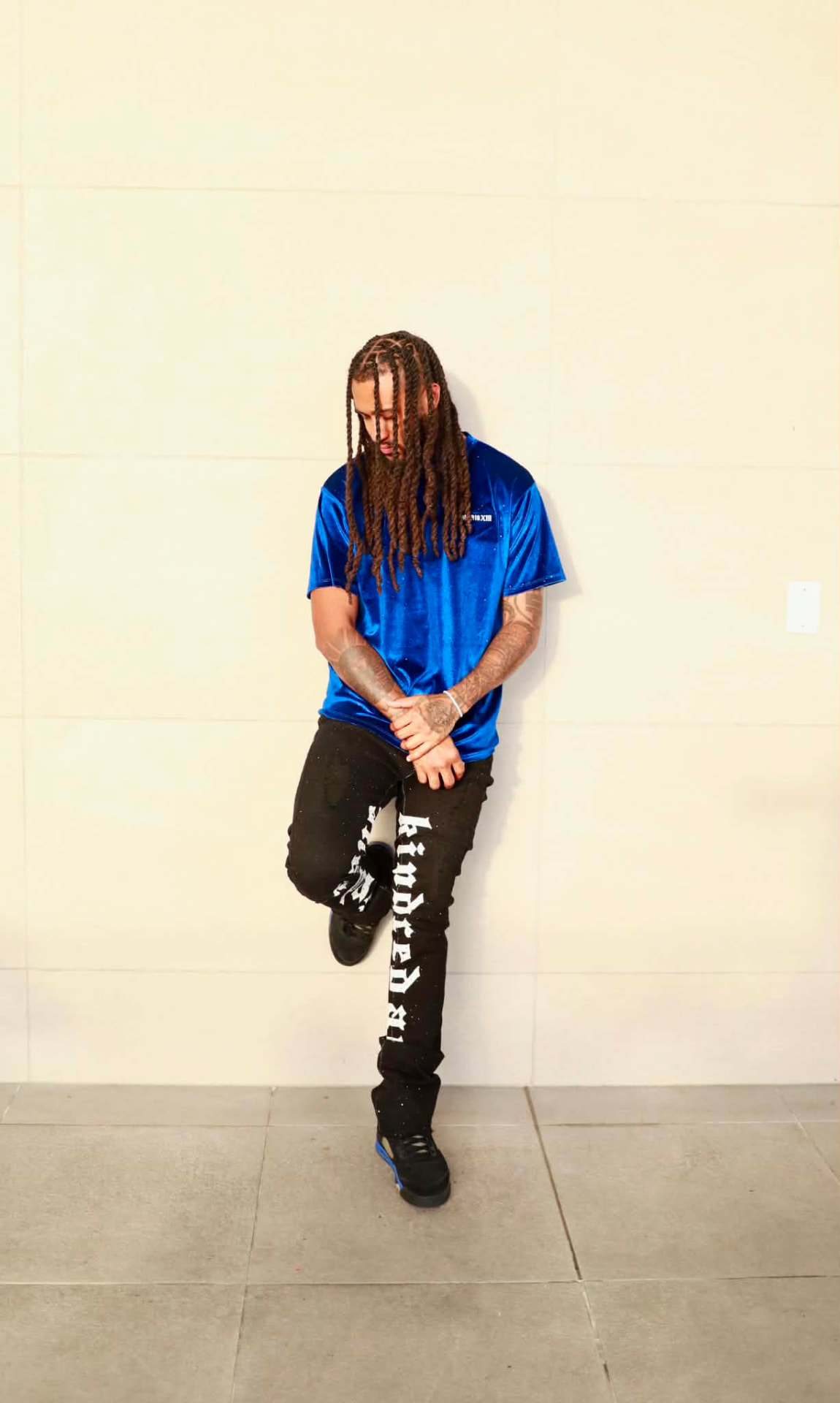 Model wearing the royal blue Imperio XIII velvet shirt