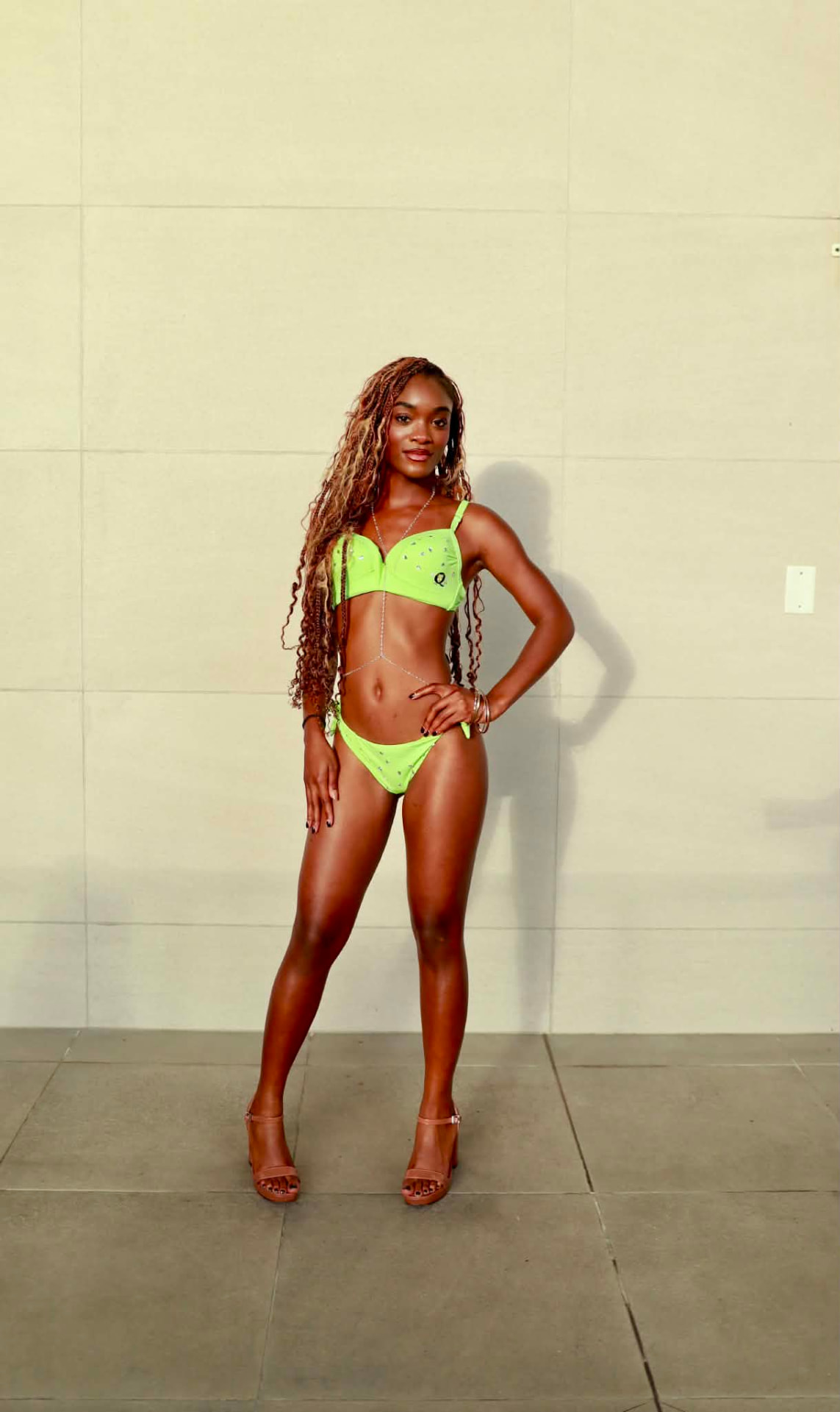 Model wearing the Imperio XIII neon resort look jewelry campaign